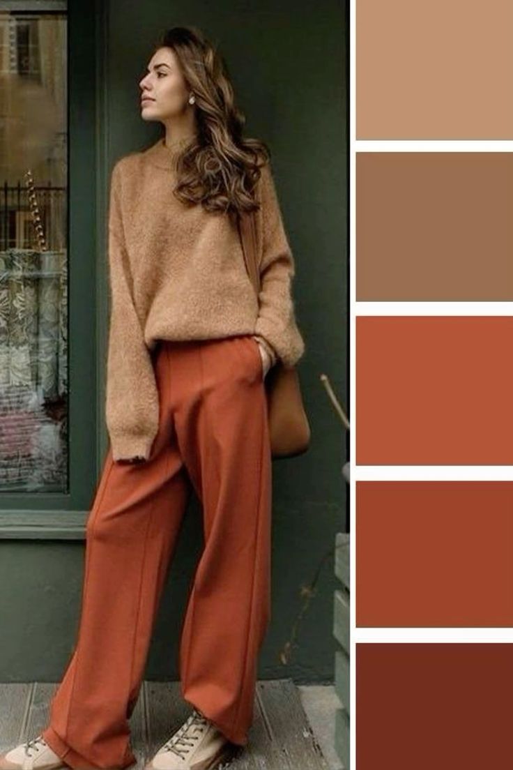 Mulher usando um look de outono com suéter marrom e calça laranja, destacando cores quentes e terrosas da estação.