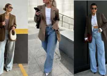 Mulheres estilosas usando calça jeans com blazer feminino em evento social, mostrando elegância e versatilidade.