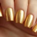 Brilhe na virada: 6 ideias de unhas para o Ano Novo 14 Unhas douradas metálicas brilhantes, perfeitas para comemorar o Ano Novo com estilo e glamour.
